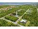 Aerial view of the neighborhood with community lakes and lush greenery at 13235 Essman Ave, Port Charlotte, FL 33953