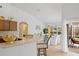 Kitchen with bar seating flows into dining area with pool view at 13235 Essman Ave, Port Charlotte, FL 33953