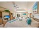 Main bedroom features natural light, access to the pool area and a cozy sitting area at 13235 Essman Ave, Port Charlotte, FL 33953