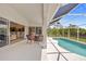 Relaxing screened-in patio featuring an inground swimming pool, great for outdoor enjoyment at 13235 Essman Ave, Port Charlotte, FL 33953