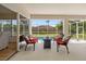Outdoor patio space featuring seating, a firepit, and views of the pool and fenced-in backyard at 13235 Essman Ave, Port Charlotte, FL 33953