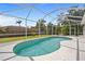 Enjoy the weather and take a dip in the cool waters of this screened-in pool at 13235 Essman Ave, Port Charlotte, FL 33953