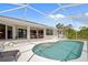 Beautiful view of the screened-in pool with an outdoor patio at 13235 Essman Ave, Port Charlotte, FL 33953