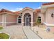 The property's front entrance features a secure screen door and a beautifully landscaped gravel yard at 149 Albert Ln, Port Charlotte, FL 33954