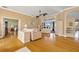 Open living area with hardwood floors, soft lighting, and access to the pool and dining areas at 149 Albert Ln, Port Charlotte, FL 33954