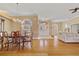 Bright living room featuring hardwood floors, chandelier and elegant white double door entryway at 149 Albert Ln, Port Charlotte, FL 33954