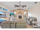 Open living room features a fireplace, vaulted ceilings, and views of the pool and canal at 149 Albert Ln, Port Charlotte, FL 33954