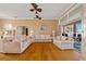 Spacious living room with hardwood floors, ceiling fans, and lots of natural light at 149 Albert Ln, Port Charlotte, FL 33954