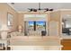 Bright living room featuring elegant sofas, hardwood floors, and a large window with a lake view at 149 Albert Ln, Port Charlotte, FL 33954