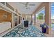 Charming lanai offers a table and seating with stunning views of the pool, waterfront, and landscaped backyard at 149 Albert Ln, Port Charlotte, FL 33954