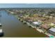 Aerial view of canal-front homes featuring boat docks and beautiful waterfront community at 15762 Aqua Cir, Port Charlotte, FL 33981