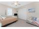 Bedroom with a full bed, side chair, a beach decor and a window with wooden shutters at 15762 Aqua Cir, Port Charlotte, FL 33981