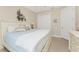Bedroom with white furniture, neutral walls, and access to other rooms in the house at 15762 Aqua Cir, Port Charlotte, FL 33981