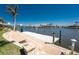 Inviting backyard with a boat dock providing easy access to the open water at 15762 Aqua Cir, Port Charlotte, FL 33981