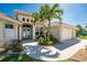 Charming facade with decorative columns and a well maintained front yard at 15762 Aqua Cir, Port Charlotte, FL 33981