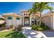 Immaculate home featuring decorative shutters, glass double doors, and lush landscaping in a desirable neighborhood at 15762 Aqua Cir, Port Charlotte, FL 33981