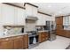 Elegant kitchen with granite countertops, stainless steel appliances, and custom cabinetry at 15762 Aqua Cir, Port Charlotte, FL 33981