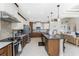 Well-designed kitchen featuring a center island with seating, stainless appliances, and open layout at 15762 Aqua Cir, Port Charlotte, FL 33981