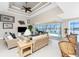 Warm and inviting living room featuring an open floor plan with a view of the pool and canal from the sliding glass doors at 15762 Aqua Cir, Port Charlotte, FL 33981
