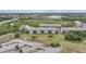Overhead photo features the condominiums with grassy areas, lakes, and parking areas surrounding buildings at 175 Kings Hwy # 226, Punta Gorda, FL 33983