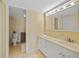 Bathroom with white cabinetry, spacious vanity, and a separate toilet area at 175 Kings Hwy # 226, Punta Gorda, FL 33983