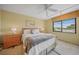 Bedroom with ceiling fan, neutral walls, and a window at 175 Kings Hwy # 226, Punta Gorda, FL 33983