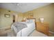 Bright bedroom with ceiling fan, cozy bedding, and warm, neutral walls at 175 Kings Hwy # 226, Punta Gorda, FL 33983