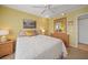 Comfortable bedroom with soft carpet, dresser, and a ceiling fan at 175 Kings Hwy # 226, Punta Gorda, FL 33983
