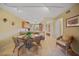 Dining area featuring a glass table with seating, open to the kitchen at 175 Kings Hwy # 226, Punta Gorda, FL 33983