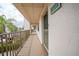 Exterior building hallway featuring unit number and views of the grounds and parking area at 175 Kings Hwy # 226, Punta Gorda, FL 33983