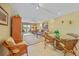 Living room and dining area with tile floors, and access to balcony with scenic view at 175 Kings Hwy # 226, Punta Gorda, FL 33983
