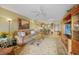 Living room with open floor plan and tile floors flowing into the dining and kitchen areas at 175 Kings Hwy # 226, Punta Gorda, FL 33983