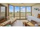 Relaxing sunroom with wicker furniture and a view of the scenery at 175 Kings Hwy # 226, Punta Gorda, FL 33983