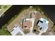 An aerial view of a waterfront home and surrounding lot with canal access and private dock at 18106 Petoskey Cir, Port Charlotte, FL 33948