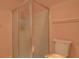 Clean and functional bathroom featuring a glass shower and toilet at 18106 Petoskey Cir, Port Charlotte, FL 33948