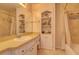 Bathroom featuring a vanity, mirror, and decorative shelves, creating a tranquil space at 18106 Petoskey Cir, Port Charlotte, FL 33948