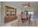 Formal dining room with a china cabinet and a wooden table set for six at 18106 Petoskey Cir, Port Charlotte, FL 33948