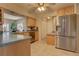Bright kitchen features stainless steel refrigerator and lots of counter space at 18106 Petoskey Cir, Port Charlotte, FL 33948