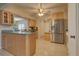 Bright kitchen features stainless steel refrigerator, and generous cabinet space at 18106 Petoskey Cir, Port Charlotte, FL 33948