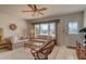 Cozy living room with comfortable seating and a glass top coffee table at 18106 Petoskey Cir, Port Charlotte, FL 33948