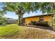 Spacious backyard featuring mature trees, lush landscaping, and privacy at 2192 Hyatt Dr, Port Charlotte, FL 33948