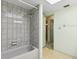 Bathroom with a shower/tub, neutral color scheme, and a view into the hallway at 2192 Hyatt Dr, Port Charlotte, FL 33948