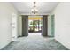 The dining room features a chandelier and sliding doors to the patio at 2192 Hyatt Dr, Port Charlotte, FL 33948
