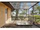 Outdoor hot tub on a wooden deck with enclosure and lush landscaping at 2192 Hyatt Dr, Port Charlotte, FL 33948