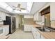 Well-appointed kitchen with stainless steel refrigerator, ample counter space, and a window view at 2192 Hyatt Dr, Port Charlotte, FL 33948