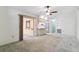 Open living room featuring a ceiling fan, view to other rooms, and easy access to the kitchen at 2192 Hyatt Dr, Port Charlotte, FL 33948