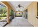 Spacious, covered patio with sliding glass doors and view of the backyard at 2192 Hyatt Dr, Port Charlotte, FL 33948