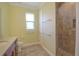 Tiled bathroom featuring a toilet, granite topped vanity, and glass-door shower at 2227 Bonn Ct, Punta Gorda, FL 33983