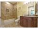 Bathroom with granite vanity, tiled shower, and tiled floors at 2227 Bonn Ct, Punta Gorda, FL 33983