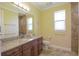 Bathroom featuring granite countertop, modern fixtures, and tiled shower at 2227 Bonn Ct, Punta Gorda, FL 33983